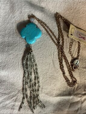 Gold-Tone Necklace with Turquoise Clover Pendant and Gray Bead Tassel